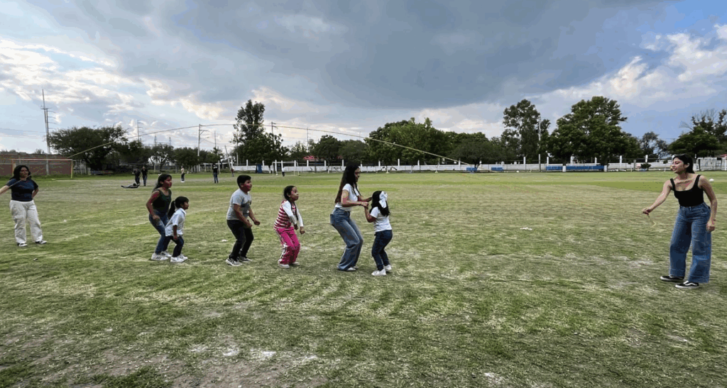 Students playing jump rope outside